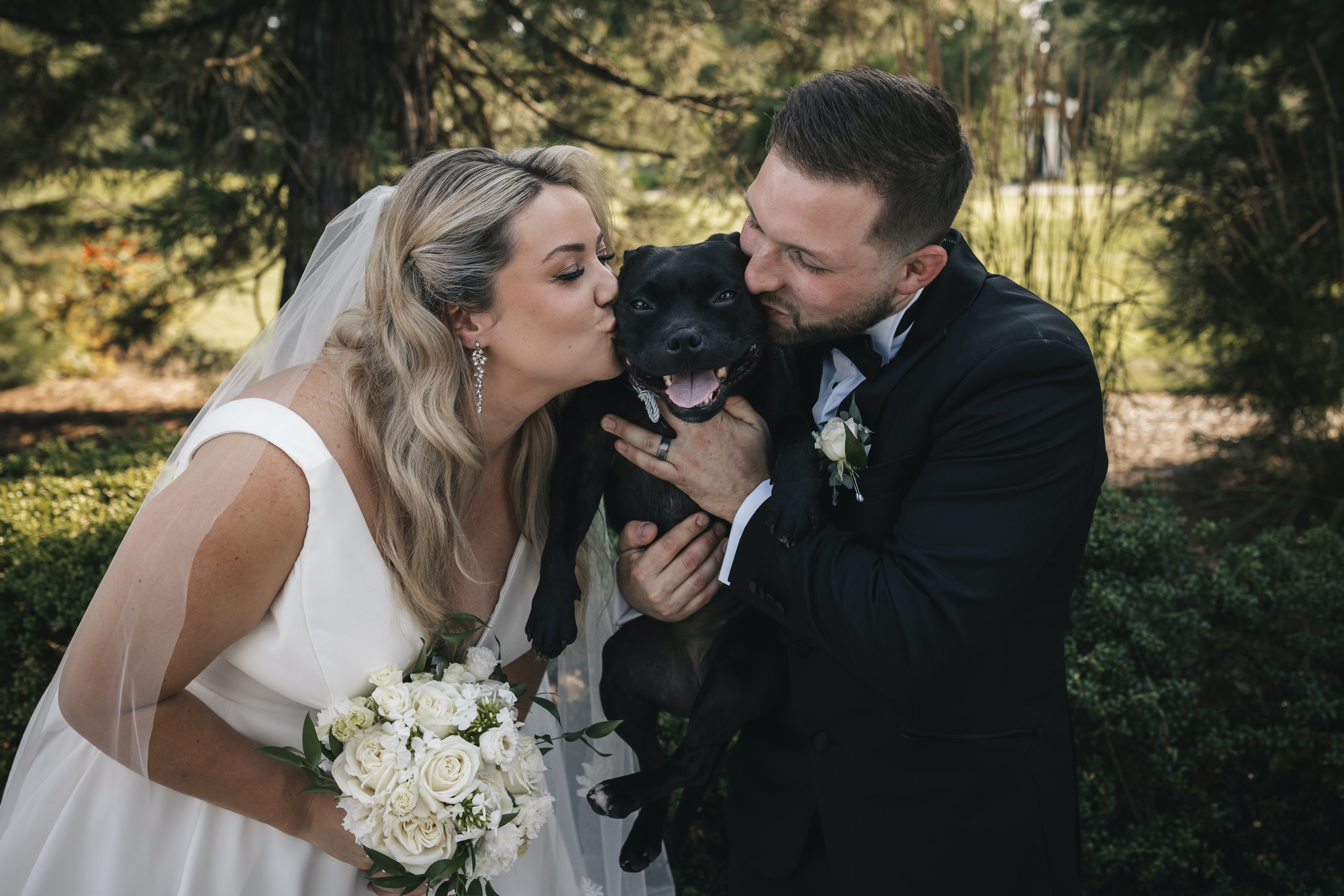 Bride and Groom with their black dog